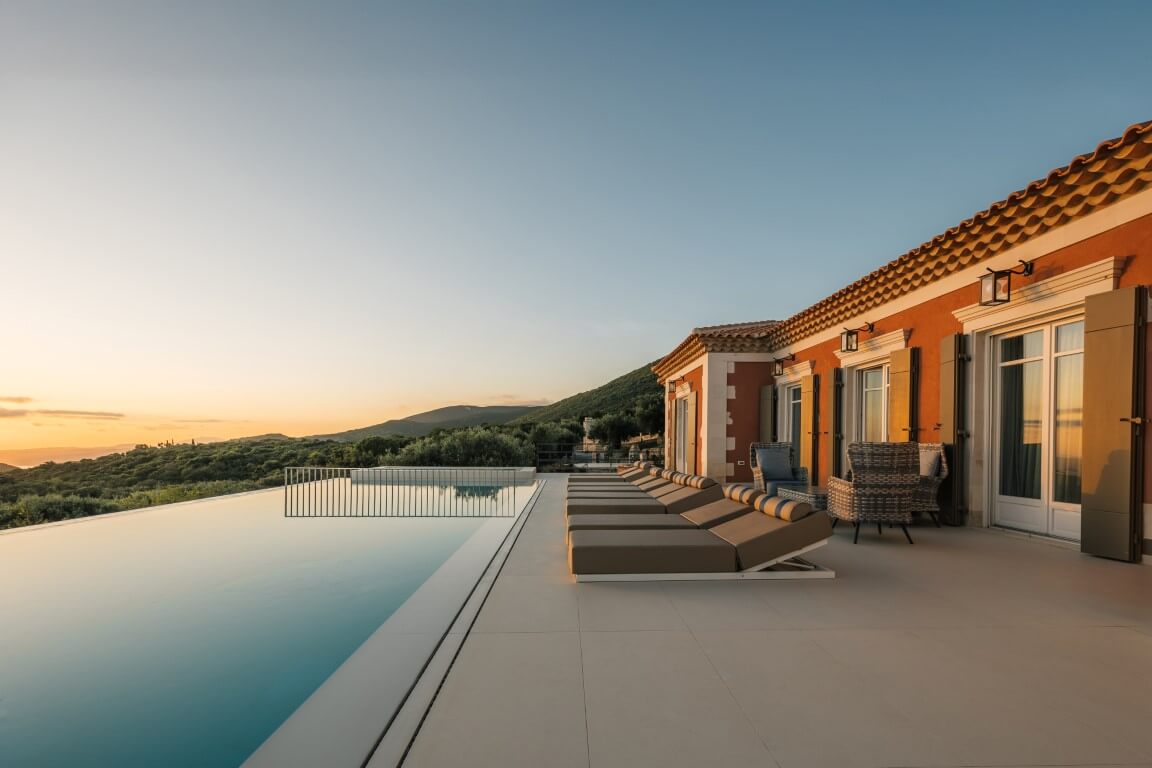 The outdoor space:: is embraced by the colors of Greek nature, providing the perfect setting for relaxation by the pool and delightful meals at the built barbecue.